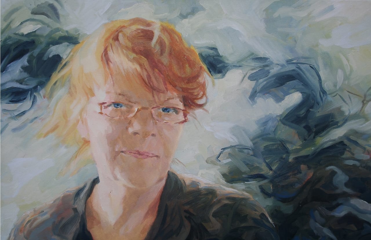 Smiling woman with glasses, posthumous portrait.